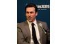 Jon Hamm's side part keeps his hair off of his face, even between cuts.